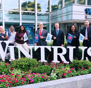 Wintrust Bank Old Town employees holding Cubs flags